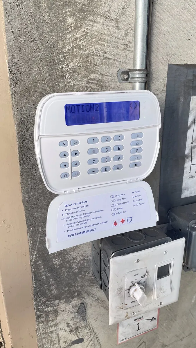 Alarm keypad installed at a commercial entrance