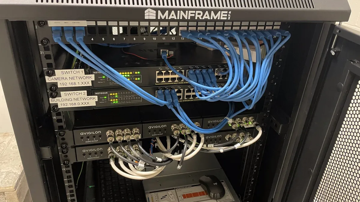 Patch panel and switch cabling in a wall-mounted network rack