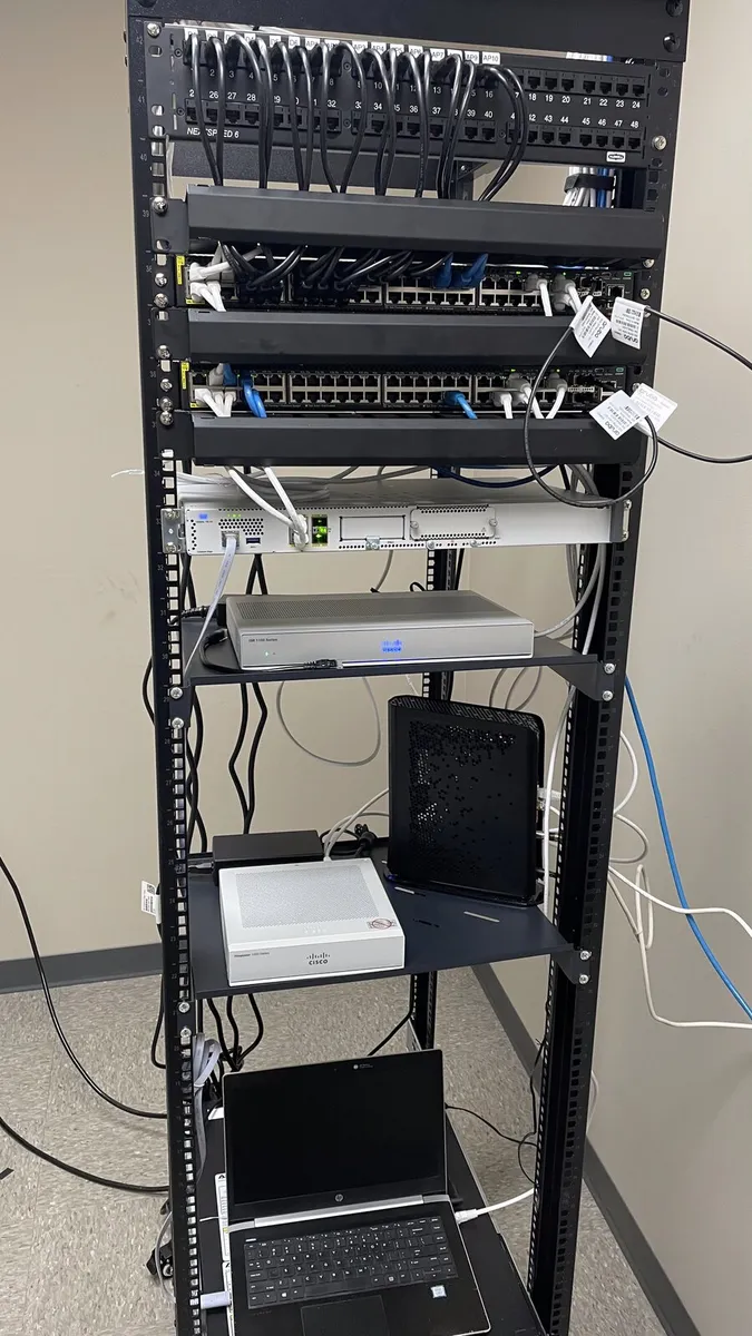 Open network rack with patch panels and switches