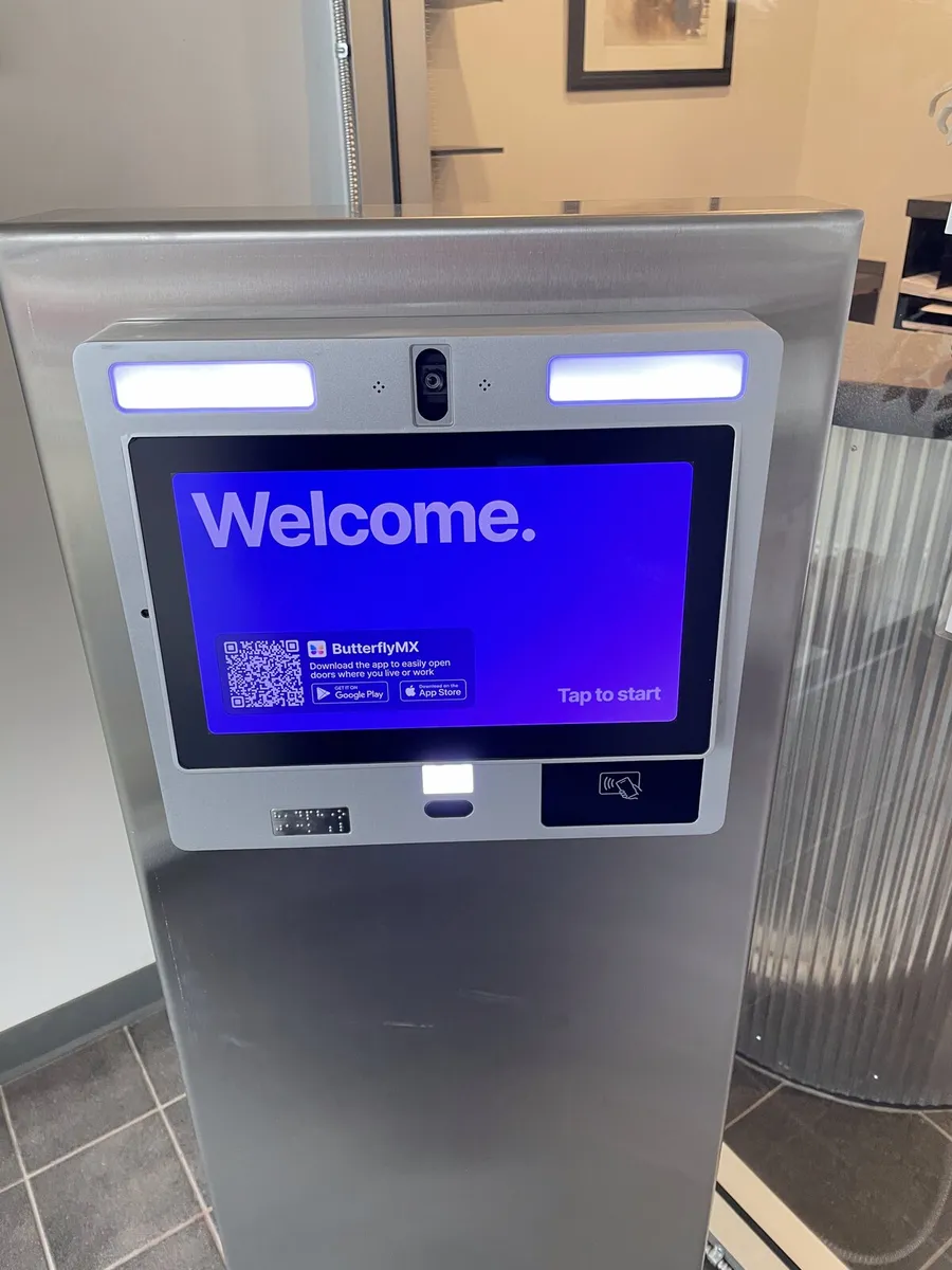 Smart video intercom kiosk in a building lobby