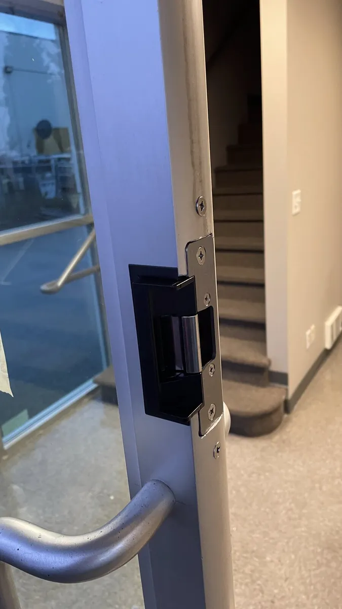 Electric strike installed on an aluminum storefront door